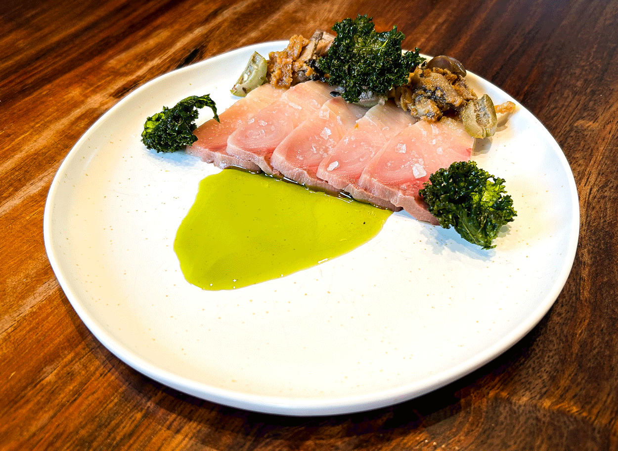 Hamachi Crudo — delicate yellowtail with citrus and micro herbs